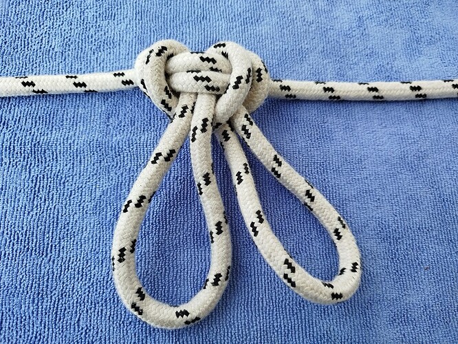 Directional double butterfly knot_back
